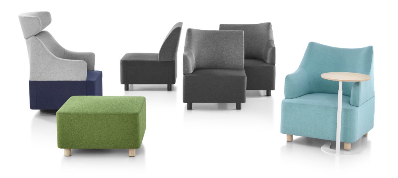 green upholstered ottoman, gray and blue armchair, gray modular seating, aqua armchair with small circular wood and white desk in a white room
